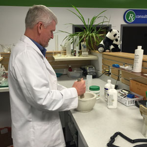 Pharmacist Mike performing non-sterile compounding at Island Prescription Center