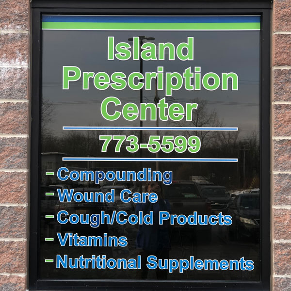 Island Prescription Center window displaying services available including medical screening (blood pressure screening)