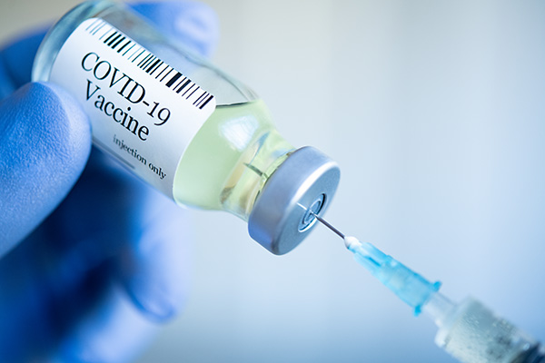 syringe in COVID-19 vial